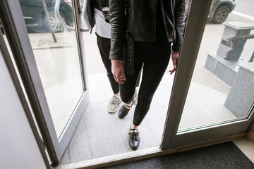 Customers coming into shop from street. Unrecognizable young people, shopping process. Stylish...