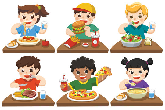 Group of Happy Kids eating delicious food on the dining table.