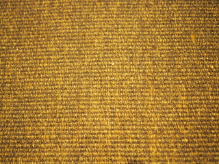 Yellow golden grainy basketry dry grass carpet background