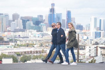 Happy family crossing the street in San Francisco