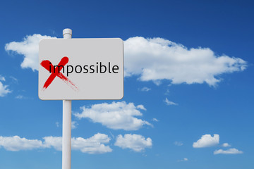 blue sky and a sign impossible possible