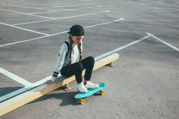 Pre teen skater on the city street