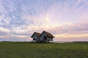 Obraz premium twin cottage red roof and nice sky in the sunset