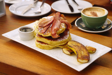 Grilled bacon on the layer of pancake