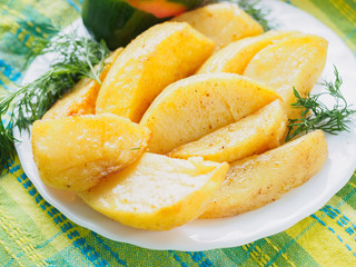 baked potatoes with greens and spices on the plate