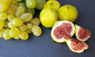 Group of fresh figs and green grapes