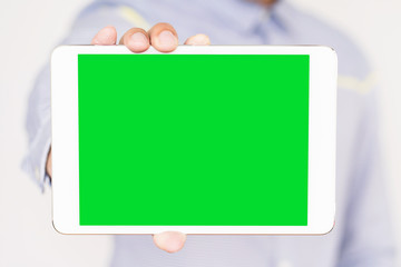 Businessman holding digital tablet  with blank screen, closeup