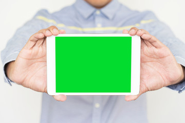 Businessman holding digital tablet  with blank screen, closeup