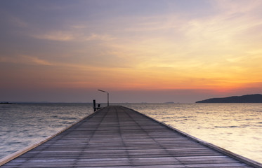 Wooden plank pier bridge with seascape sunrise at Khao Laem Ya Mu Ko Samet National Park, Rayong Province, Thailand