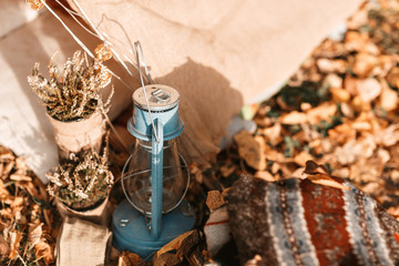 Fototapeta na wymiar kerosene lamp. old tent in the autumn forest, home for adventure and travel