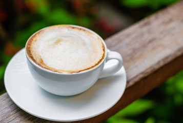 a white cup of coffee