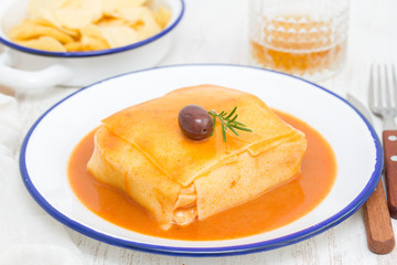 tradirional portuguese dish francesinha on dish
