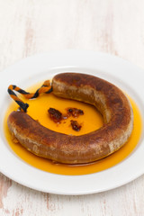 fried smoked sausage farinheira on white plate