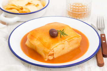 tradirional portuguese dish francesinha on dish