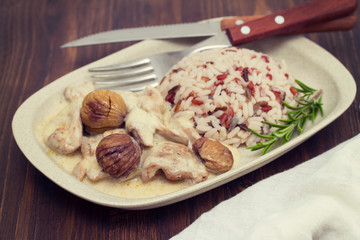 turkey with chestnut and boiled rice on dish