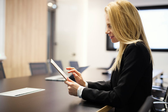 Portrait Of Beautiful Blonde Businesswoman Holding Tablet