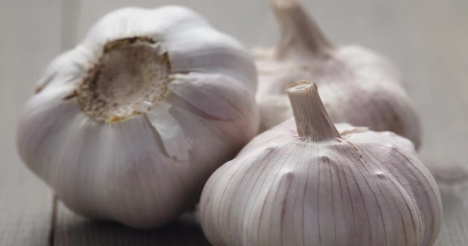 whole garlic on wood table