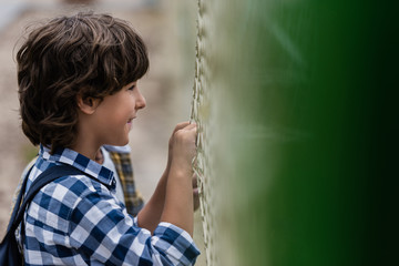 child looking through net