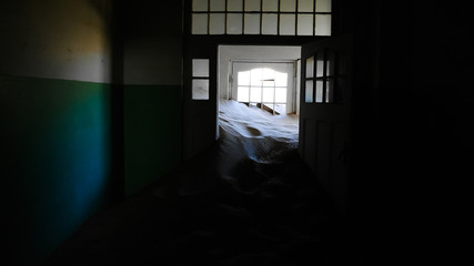 Interior of ruined house in ghost-town Kolmanskop Namibia
