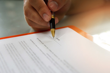 Close up of business man signing contract making a deal, business contract details. Businessman...