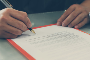Close up of business man signing contract making a deal, business contract details. Businessman...