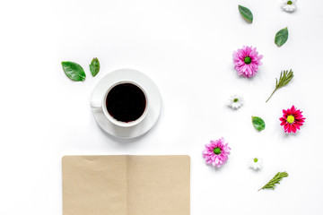 Froral flat lay with cup and notepaper top view mockup