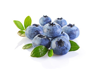 Healthy food. Close up view fresh ripe blueberry with leaves