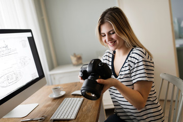 Naklejka premium Picture of young female designer holding camera