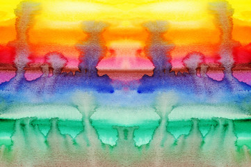 Flowing stains of paint of watercolor running on the paper