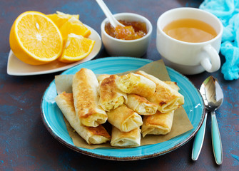 Fried rolls with dough filo and cheese curd cheese filling.