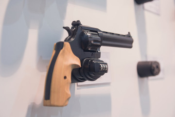 Revolver in a shop window in a weapons shop. Weapons