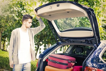 people travelling by car with suitcases and luggage