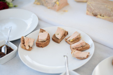 Slices of foie gras with salt and jam
