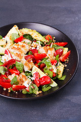 Chicken, strawberry, avocado and spinach salad with almonds