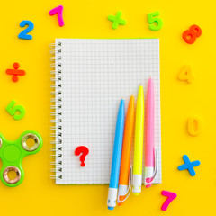 Notebook with multicolored numerals, pens and hand spinner - antistress