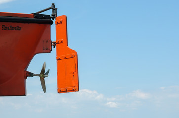 orange rescue boat in the air - I went on vacation