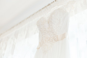 Fototapeta na wymiar Details of wedding dress hanging