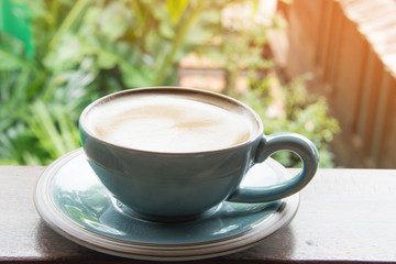 hot latte coffee on wooden table.