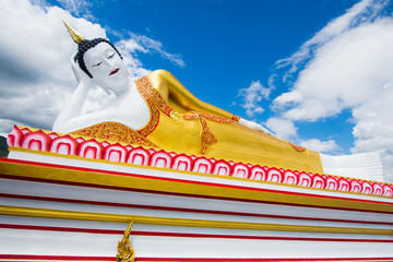 buddha statue with blue sky at Wat Phra That Doi Kham, Chiang Mai, Thailand.