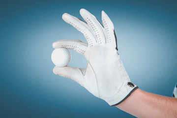 Emotional handsome golfer player pose in studio on blue and green background