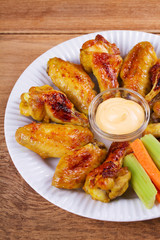 Chicken wings buffalo. Chicken with celery and carrot sticks