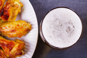 Beer and chicken wings buffalo. Ale. Beer and food concept. View from above, top studio shot