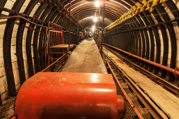 Empty conveyor belt in underground coal mine. Crisis in the mining industry