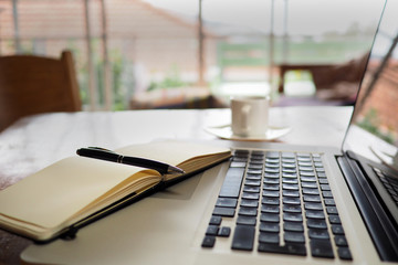 Note pad and keyboard in home office