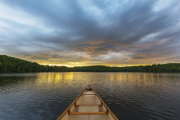 Fototapeta na wymiar Canoe bow on a Canadian lake at sunset