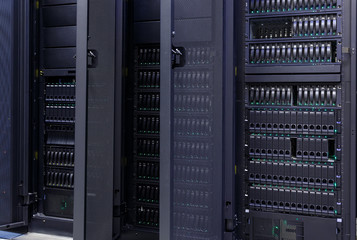 Row of supercomputers with large disk storage modern data center