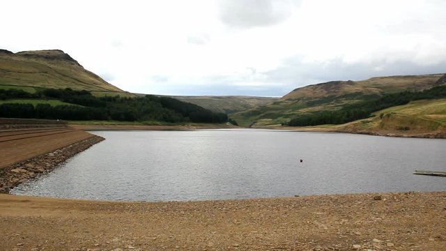 Dovestone reservoir with Saddleworth Moor at end of summer. The reservoir is at a low level following a relatively dry summer in 2013, but not yet so low as to cause concern about water supplies.