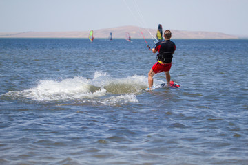 Man is engaged in kitesurfing