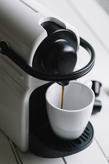machine serving espresso coffee top view