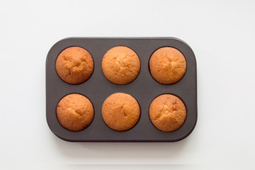 Presentation of traditional cupcakes on a small tray